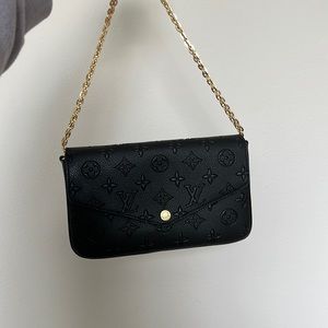 small black wallet on chain